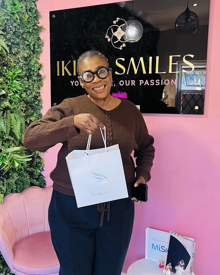 Confident Patient Holding Angel Aligner Kit