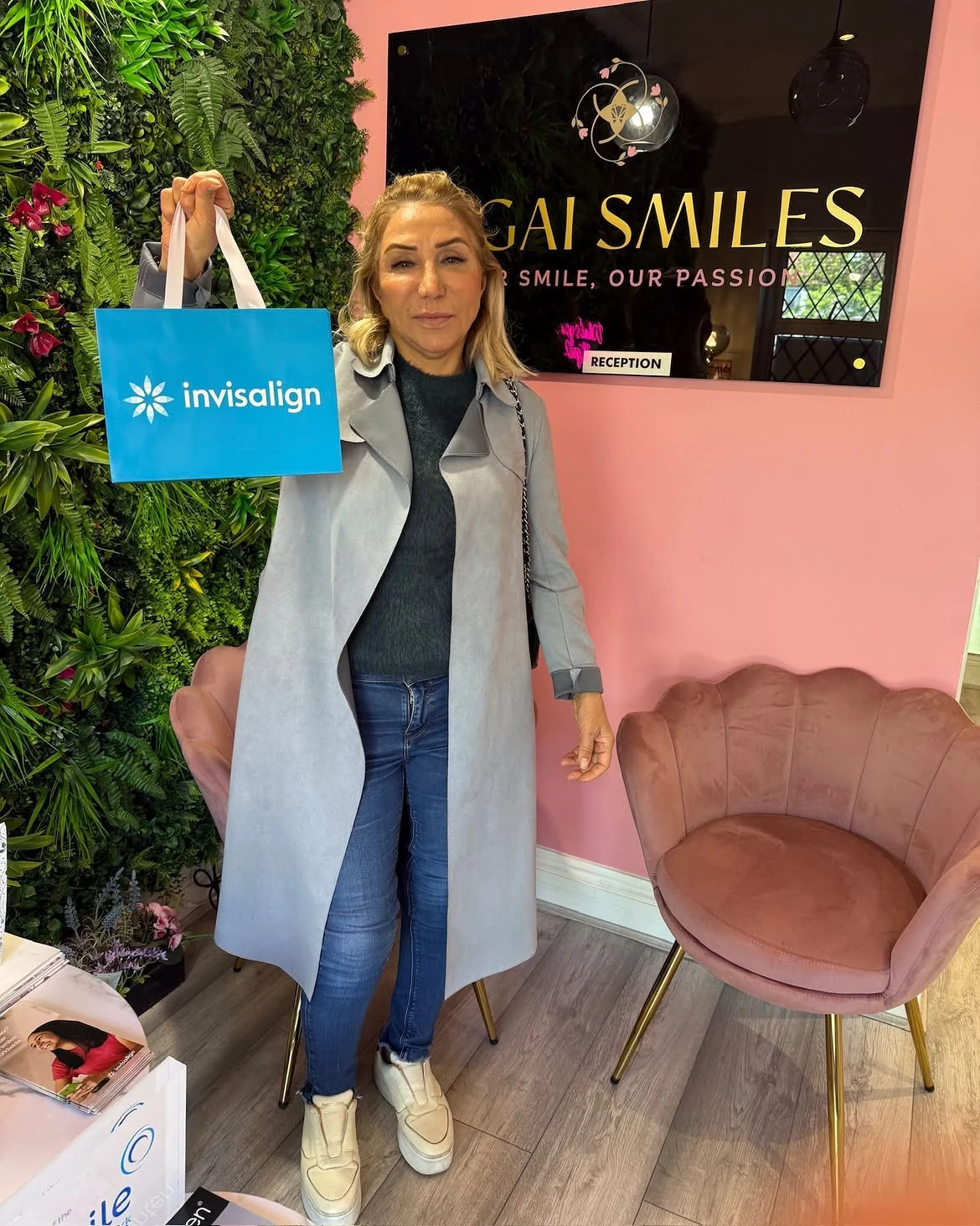Confident Patient with Invisalign at Clinic Reception